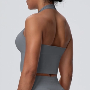 Detail of grey seamless racerback sports bra showing high-elasticity knit fabric texture
