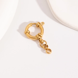 Detail of a golden stainless steel spring ring clasp with a small link chain accessory