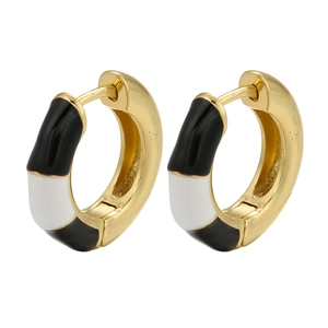 Gold huggie earrings with black and white enamel stripe pattern on white background