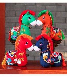 Detailed view of colorful traditional Chinese folk style plush horse toys with embroidery