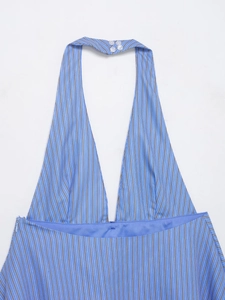 Detail of blue and white striped halter neck top with three buttons and vertical texture