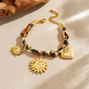 Vintage gold sun face and heart charm bracelet with leopard print fabric chain strap
