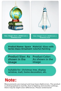 Detail of glass globe on books and space shuttle ornaments for Christmas tree decor