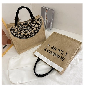 Detail of vintage jute tote bags set showing woven texture and ethnic geometric patterns