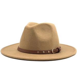 Detailed close-up of khaki wool fedora hat with brown leather belt and gold rivets