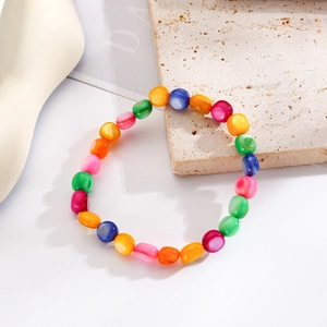 Detail shot of bohemian colorful natural stone beads on an elastic stretch bracelet