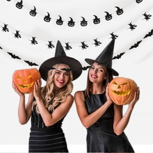 Halloween lifestyle shot showing 3D bat wall stickers and pumpkin garlands background