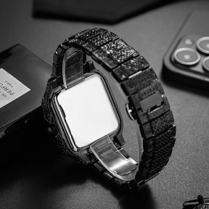 Close-up of luxury black square smartwatch case and band with pavé set crystals in a dark setting