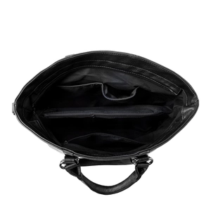 Top-down view of large tote bag interior showing compartments and zipper pockets