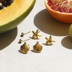 Detailed set of gold sea shell, starfish, and blue gemstone stud earrings with tropical fruits