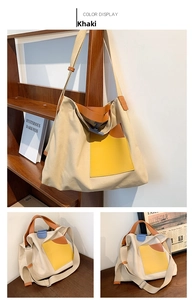 Detail of khaki canvas bucket bag with yellow contrast pocket and adjustable strap