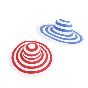 Classic wide-brim striped straw hats in blue and red for sun protection and summer beach style