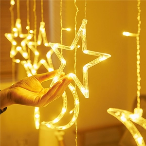 Warm yellow LED star and moon curtain lights for romantic indoor Christmas decor