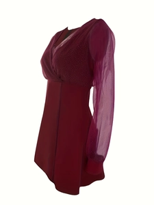 Detail of wine red V-neck dress featuring sheer mesh sleeves with polka dot pattern