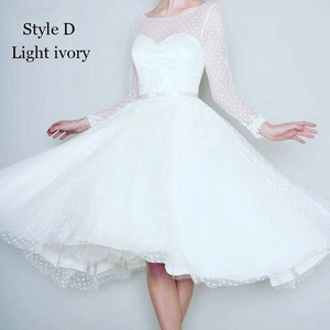 Vintage light ivory polka dot tulle wedding dress with long sleeves and a satin belt