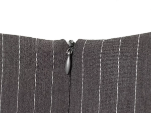 Detail of grey striped woven fabric featuring a high-quality invisible back zipper closure