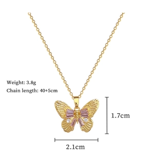 Detailed view of golden butterfly necklace with pink baguette stones and size dimensions