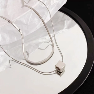Minimalist double-layered silver snake chain necklace with a cubic pendant for unisex