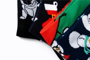 Detail view of cotton Christmas socks featuring festive bulldog, snowman and Santa patterns