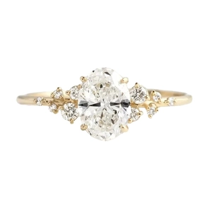 Elegant s925 silver golden ring featuring an oval zircon center stone and side diamonds