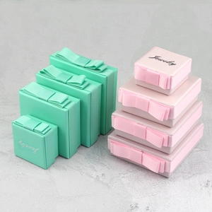 Green and pink jewelry gift boxes in four sizes with ribbon bows and jewelry logo