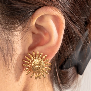 Golden stainless steel sun-shaped stud earrings with polished metallic finish for women