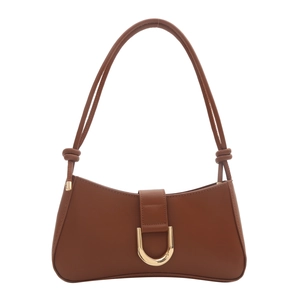 Detail of a brown leather shoulder bag featuring a golden buckle and knotted strap