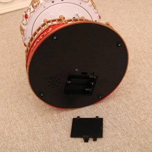 Detail view of the carousel music box bottom showing battery compartment and speaker