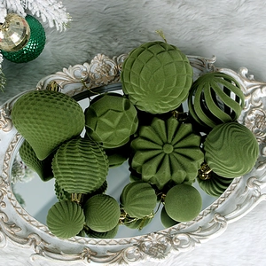 Green flocked Christmas ball ornament set in various shapes on a vintage mirrored tray
