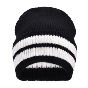 Detailed view of the thick vertical rib knit texture and black and white stripes on the beanie