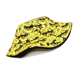 Close-up of yellow bucket hat with cartoon duck pattern and high-quality stitching