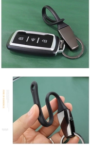 Detail of high-elasticity black rubber strap and polished titanium car keychain assembly