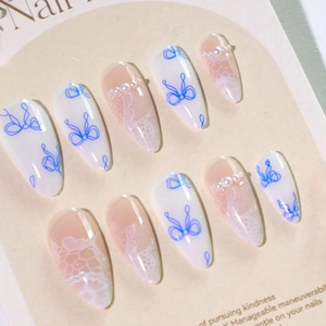 Blue bow and lace design press-on nails with white pearls on long oval shape