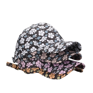 Floral print baseball caps in four colors featuring tropical hibiscus patterns and curved brims