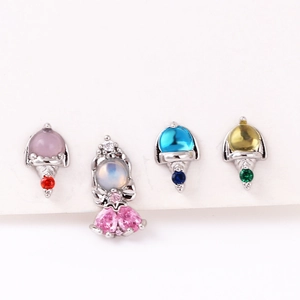 Macro detail of 925 silver stud earrings set with colorful zircon in ice cream shapes