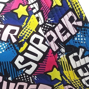 Detail of polyester bucket hat with pop art Super print, stars and polka dots
