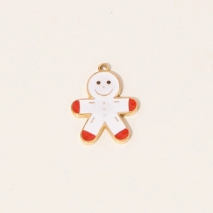 Detail of gingerbread man pendant with white enamel finish and gold edges for jewelry