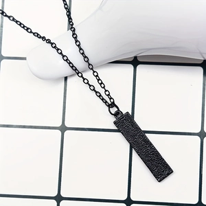 Minimalist black rectangle pendant necklace with piano keyboard pattern on a fine chain