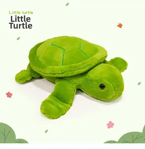 Close-up of green plush turtle pillow with soft short plush texture and embroidery