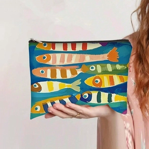 Detail view of large capacity canvas bag with colorful artistic fish pattern and zipper