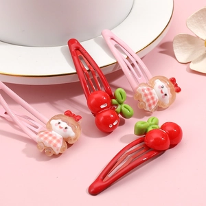 Set of cute cartoon girl and cherry hair clips for girls in pink and red colors