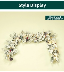 Close-up of pre-lit Christmas garland with flocked snow, pine cones, and red berries