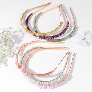 Detail of colorful natural crushed stone headbands featuring metal wire wrap design
