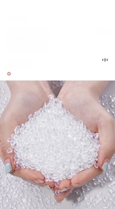Macro shot of high-quality translucent raw PE plastic pellets for kitchen trash bags