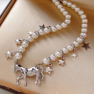 Star and pony charm pearl necklace elegantly displayed on a premium satin jewelry box