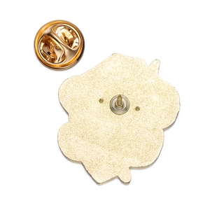 Detail view of the gold alloy badge back showing textured finish and butterfly clutch pin