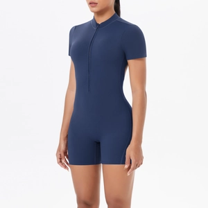 Detailed side view of navy blue short sleeve jumpsuit with front zipper and stand collar