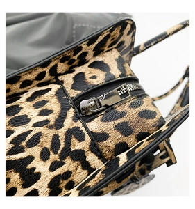Close-up of leopard print bag texture with high-quality silver metal zipper detail