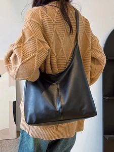 Large capacity black PU leather tote bag shown on model for professional commute style