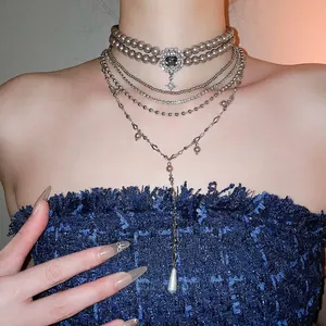 Elegant multi-layered gray pearl necklace set with emerald-cut dark stone pendant